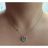 Sterling Silver Blue Topaz Floral Pendant - Exclusively Continental
